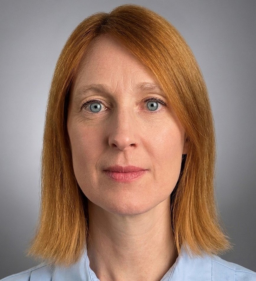 A professional headshot of Teresa Primavesi-Poggio with a confident look.
