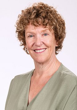Karen Walker professional portrait with light background.