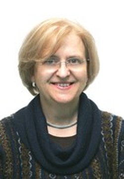 Portrait of Prof. Hercília Guimarães Portrait of Prof. Hercília Guimarães with short blonde hair and glasses