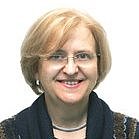 Portrait of Prof. Hercília Guimarães with short blonde hair and glasses
