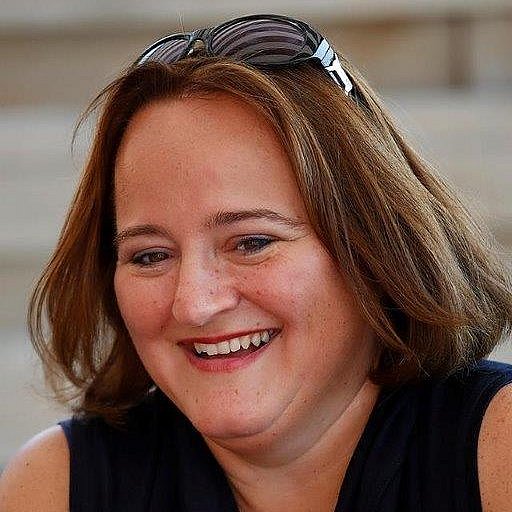 Portrait of Monique Oude Reimer smiling outdoors.