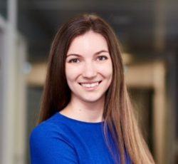 A professional headshot of Bianka Gallina, smiling in a blue outfit.