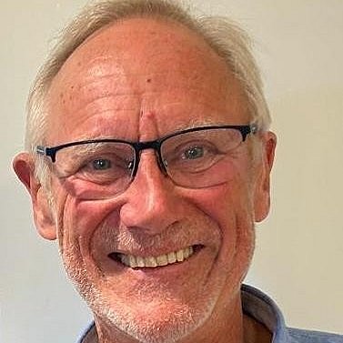 Portrait of Dr. Björn Westrup smiling and wearing a blue shirt.