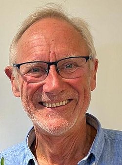 Portrait of Dr. Björn Westrup smiling and wearing a blue shirt.
