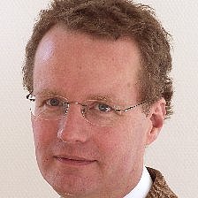 Portrait of Christian Poets with glasses and suit.