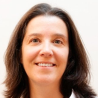 Portrait of Estela Coutinho smiling.