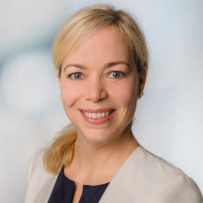 A professional portait headshot of Catherina Witte wearing a beige blazer.