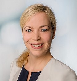 A professional portait headshot of Catherina Witte wearing a beige blazer.