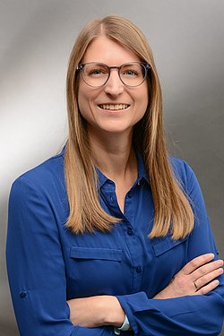 A professional headshot of Yvonne Willibald wearing a blue blouse.