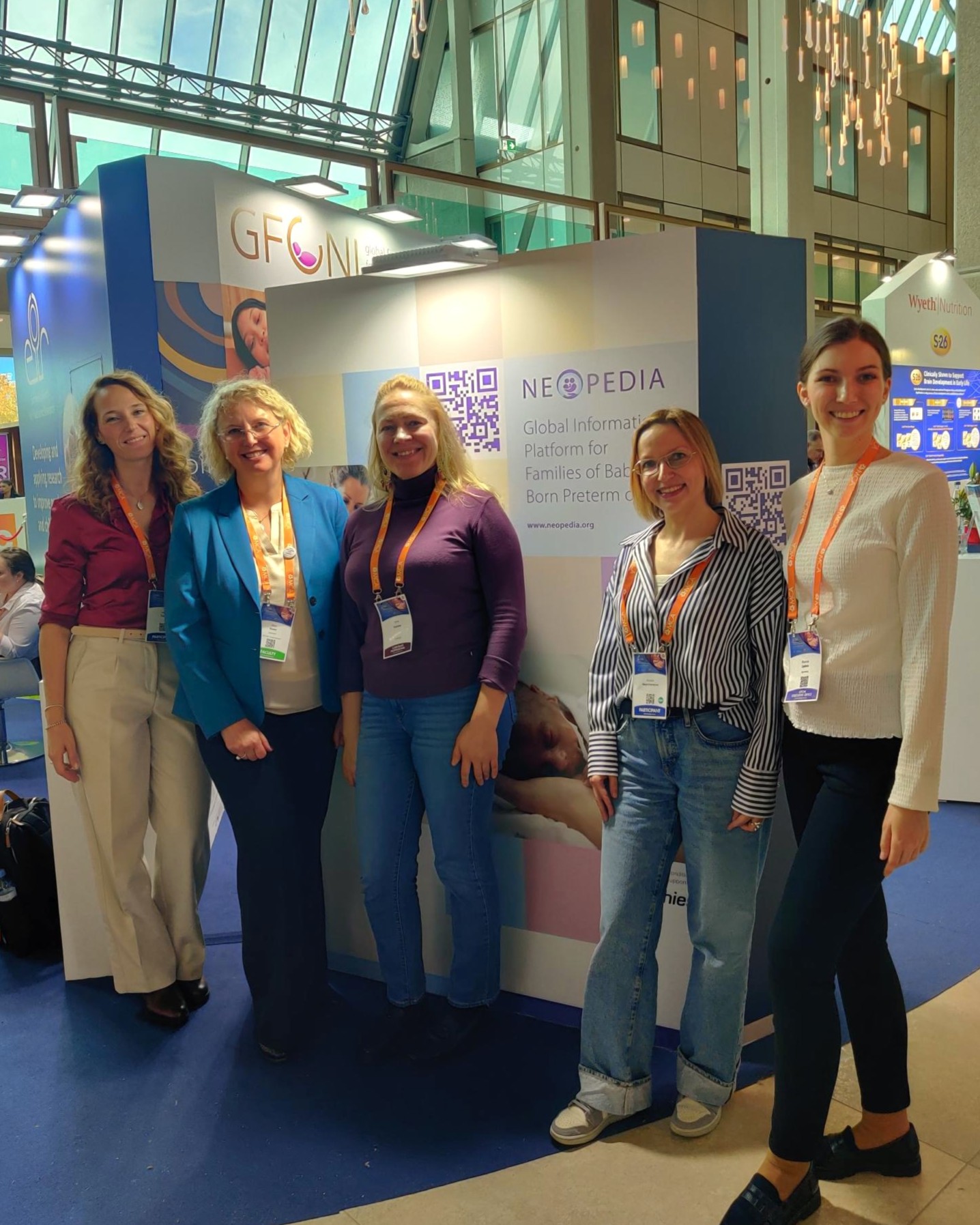 Group photo of participants from GFCNI and Chiesi in front of the Neopedia booth wall at jENS 2025 neonatal congress in Belgrade, Serbia