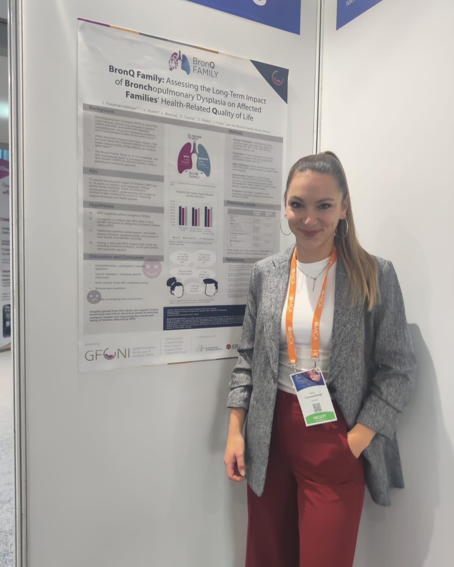 Ilona Trautmannsberger next to the BronQ Family poster at jENS 2025 neonatal congress in Belgrade, Serbia