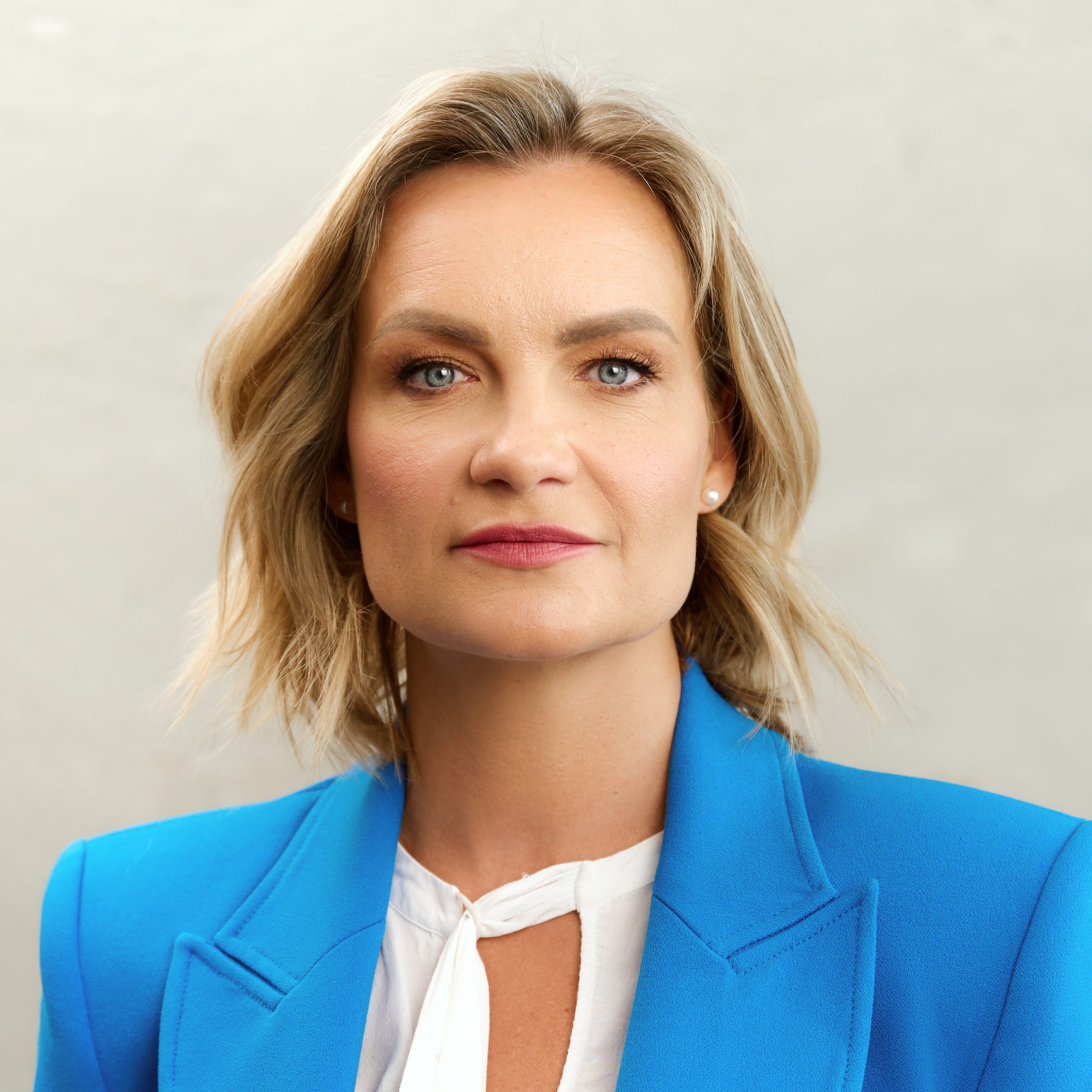 Portrait of Asta Radzeviciene wearing a blue blazer.