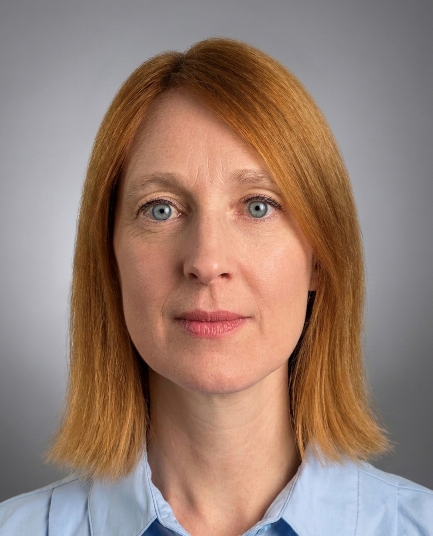 A professional headshot of Teresa Primavesi-Poggio with a confident look.