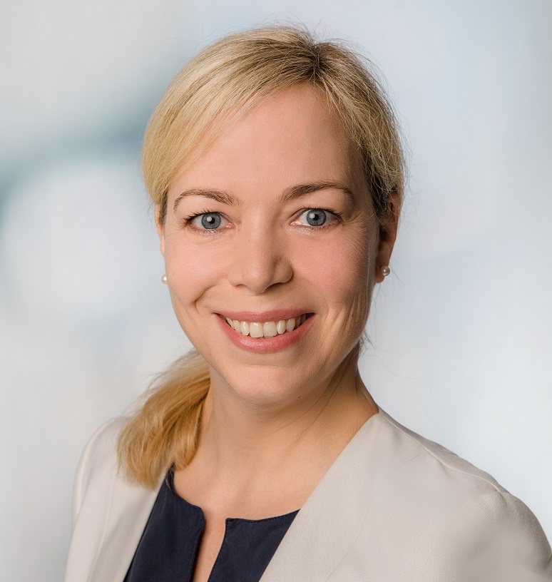 A professional portait headshot of Catherina Witte wearing a beige blazer.