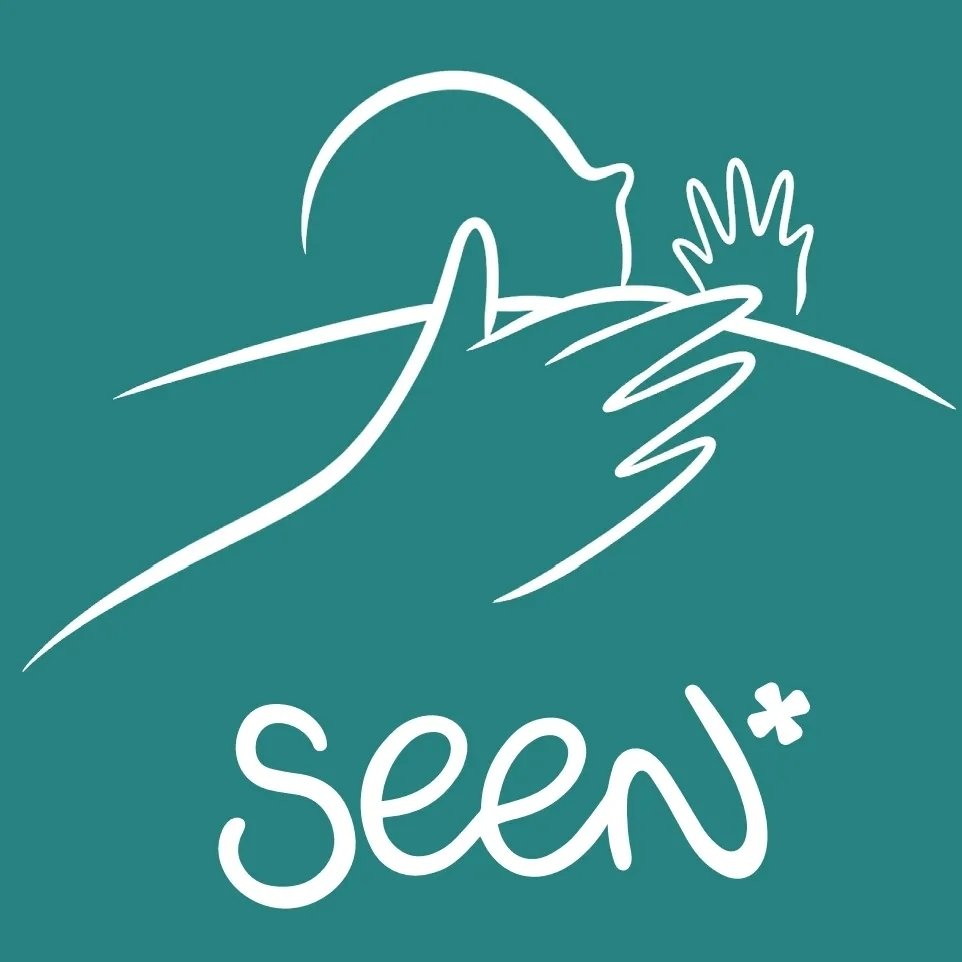 SEEN logo on a teal background showing a white line drawing of a parent holding a baby, with the name SEEN below.