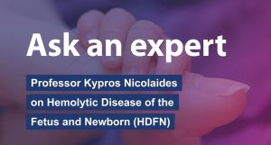 A banner reading "Ask an expert: Professor Kypros Nicolaides on Hemolytic Disease of the Fetus and Newborn (HDFN)" over a background of a newborn’s hand being gently held.
