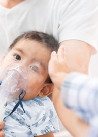 Parent holding an infant during an RSV hospitalization